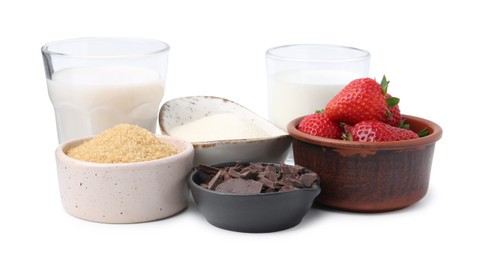 Photo of Different ingredients for panna cotta. Milk, sugar, vanilla, chocolate and strawberries isolated on white