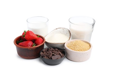 Photo of Different ingredients for panna cotta. Milk, sugar, vanilla, chocolate and strawberries isolated on white