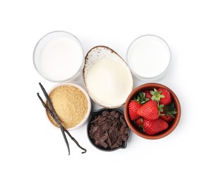 Photo of Different ingredients for panna cotta. Milk, sugar, vanilla, chocolate and strawberries isolated on white, top view