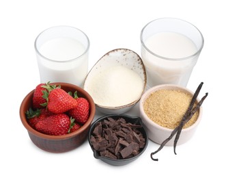 Photo of Different ingredients for panna cotta. Milk, sugar, vanilla, chocolate and strawberries isolated on white