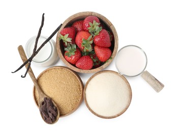 Photo of Different ingredients for panna cotta. Milk, sugar, vanilla, chocolate and strawberries isolated on white, top view
