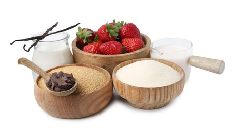 Photo of Different ingredients for panna cotta. Milk, sugar, vanilla, chocolate and strawberries isolated on white