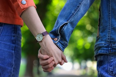 Photo of Lovely couple walking together in park, closeup