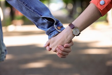 Photo of Lovely couple walking together in park, closeup