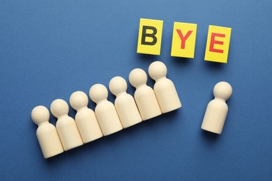 Photo of Dismissal. Word Bye and human figures on blue background, flat lay
