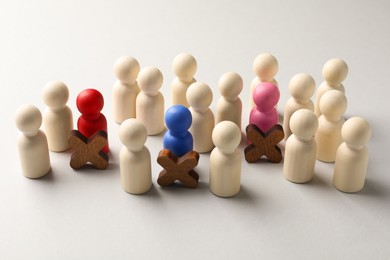 Photo of Unemployment. Many different human figures on light background