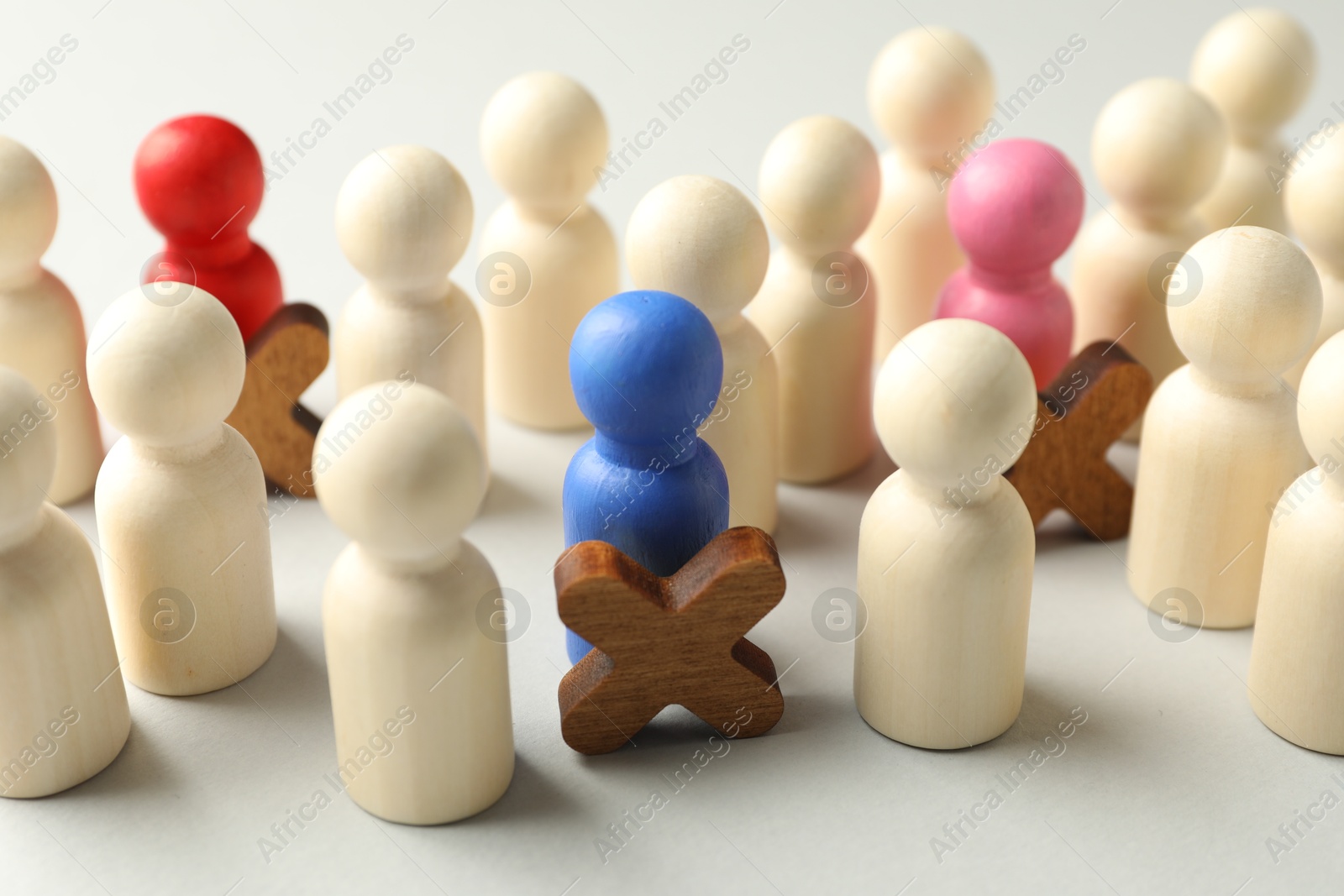 Photo of Unemployment. Many different human figures on light background, closeup