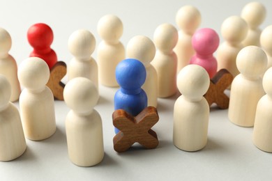 Photo of Unemployment. Many different human figures on light background, closeup