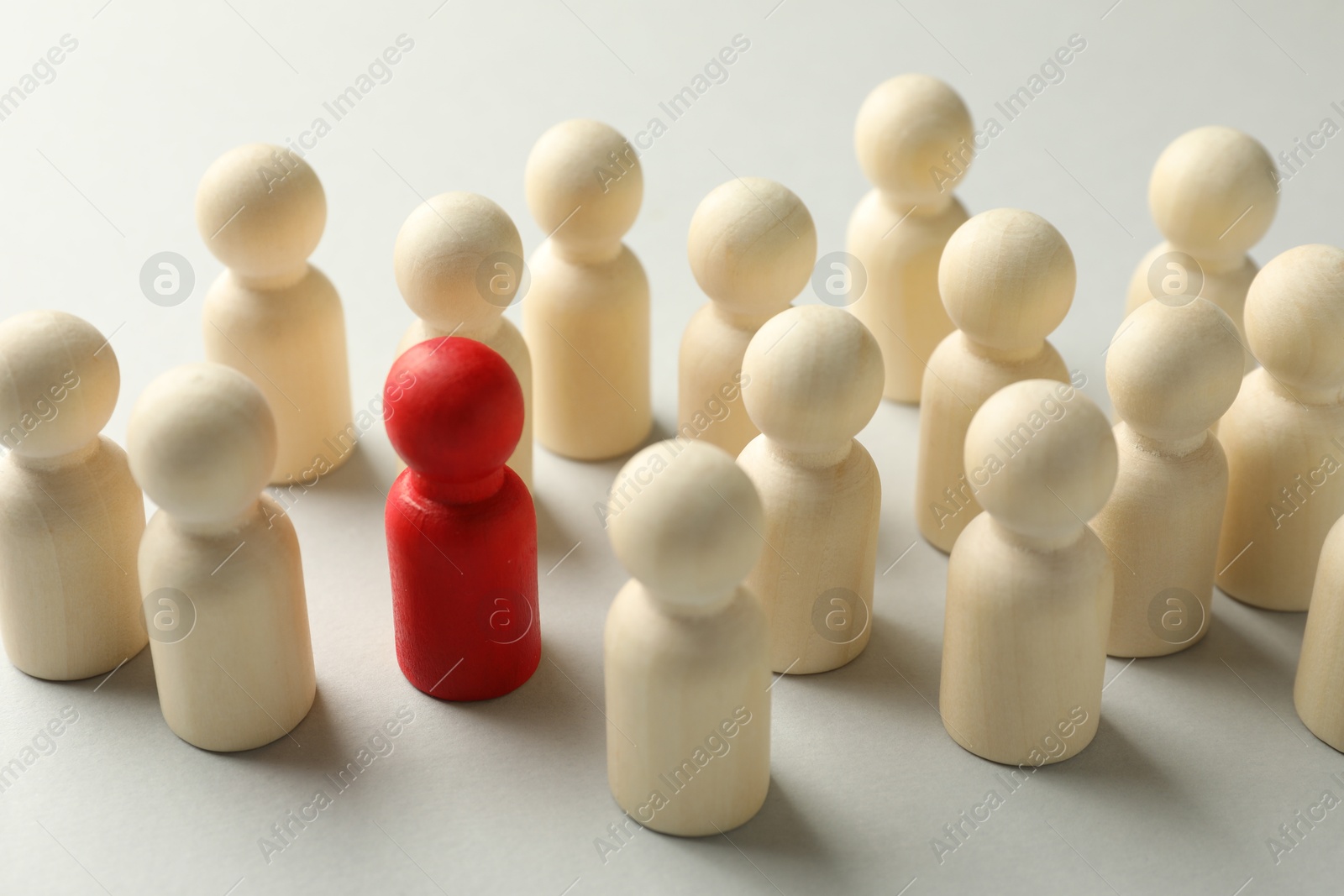Photo of Unemployment. Many different human figures on light background, closeup