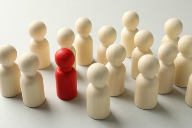 Photo of Unemployment. Many different human figures on light background, closeup