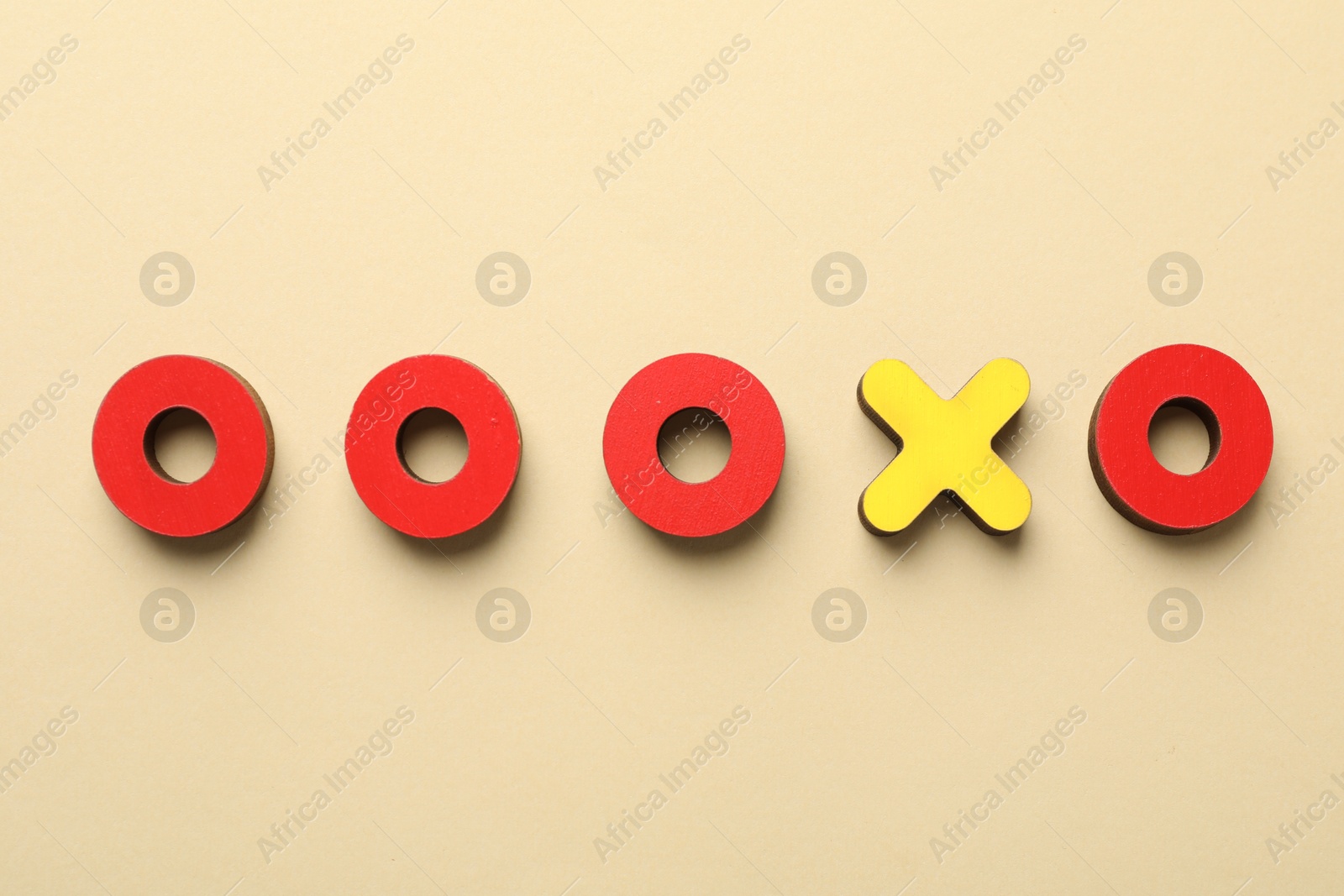 Photo of Unemployment. Tic tac toe figures on beige background, flat lay