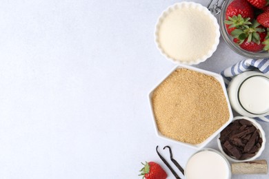 Photo of Different ingredients for panna cotta. Milk, sugar, vanilla, chocolate and strawberries on white table, flat lay. Space for text