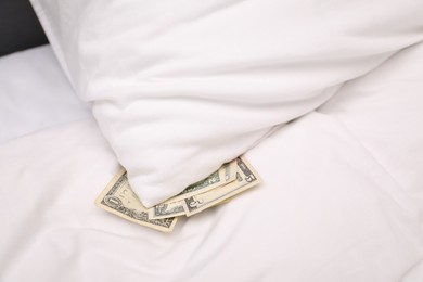 Photo of Tips under pillow on bed in hotel, closeup. Gratuity for work