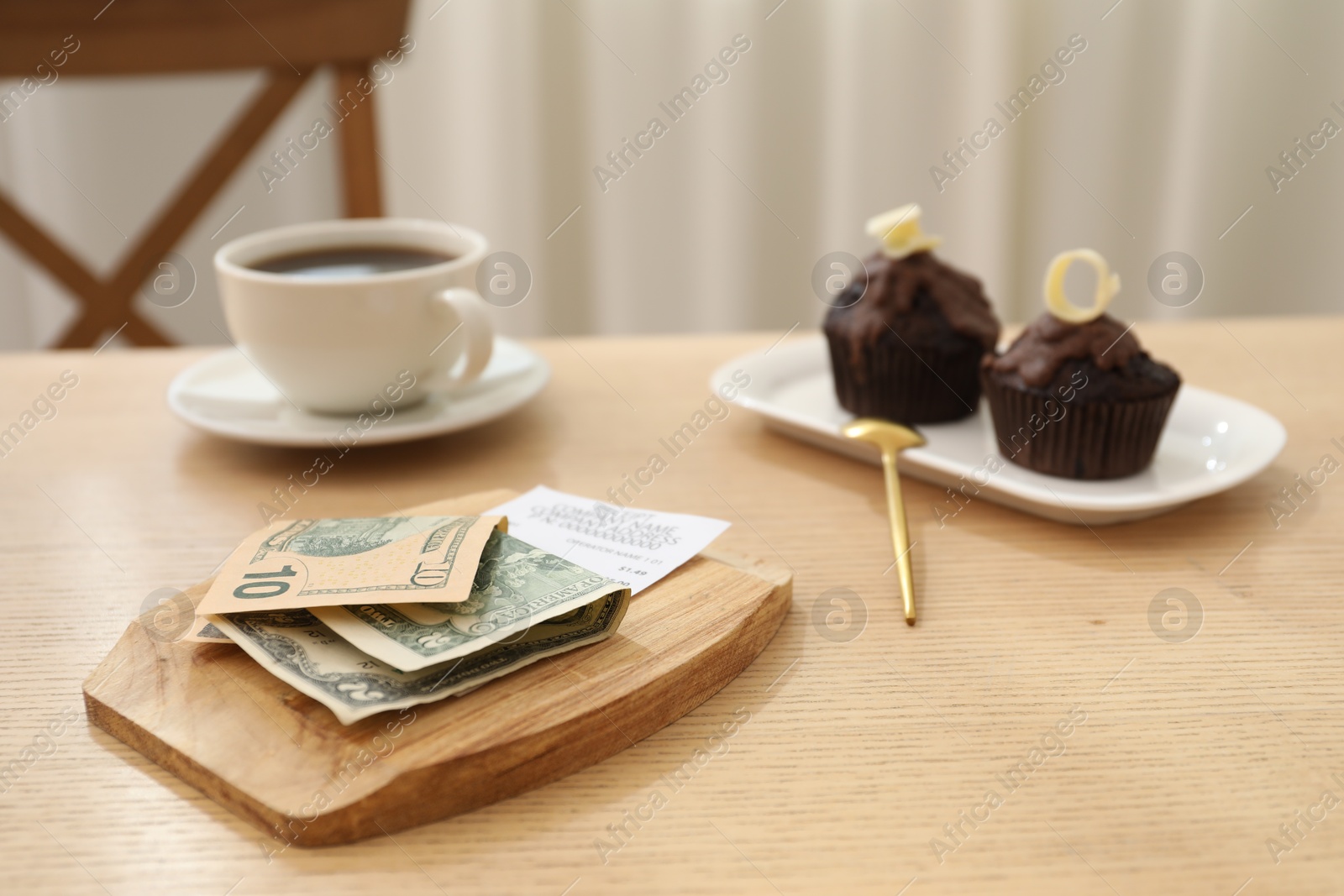 Tips, receipt and order on wooden table in restaurant, closeup. Gratuity for work Photo of Tips, receipt and order on wooden table in restaurant, closeup. Gratuity for work