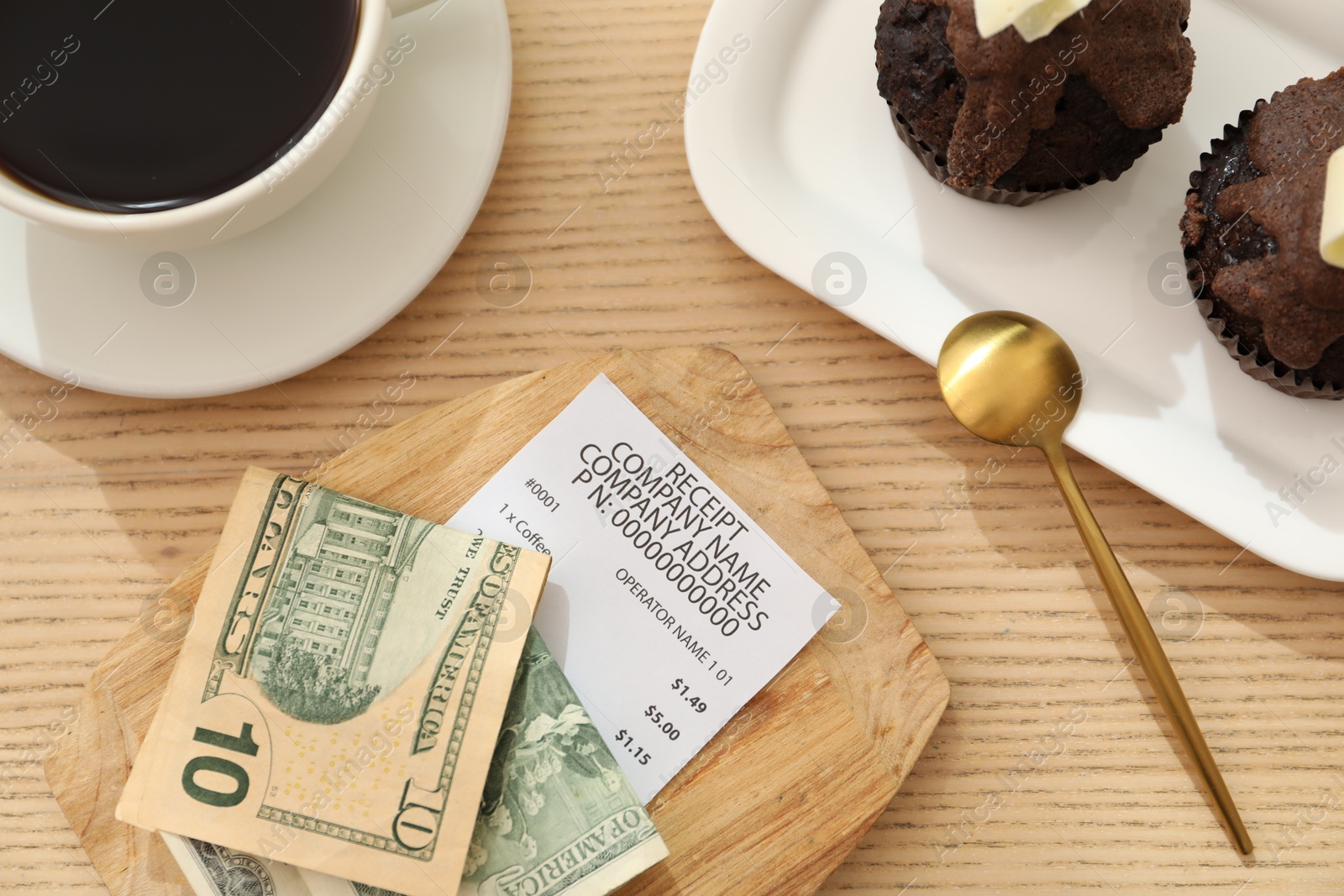 Tips, receipt and order on wooden table, flat lay Photo of Tips, receipt and order on wooden table, flat lay