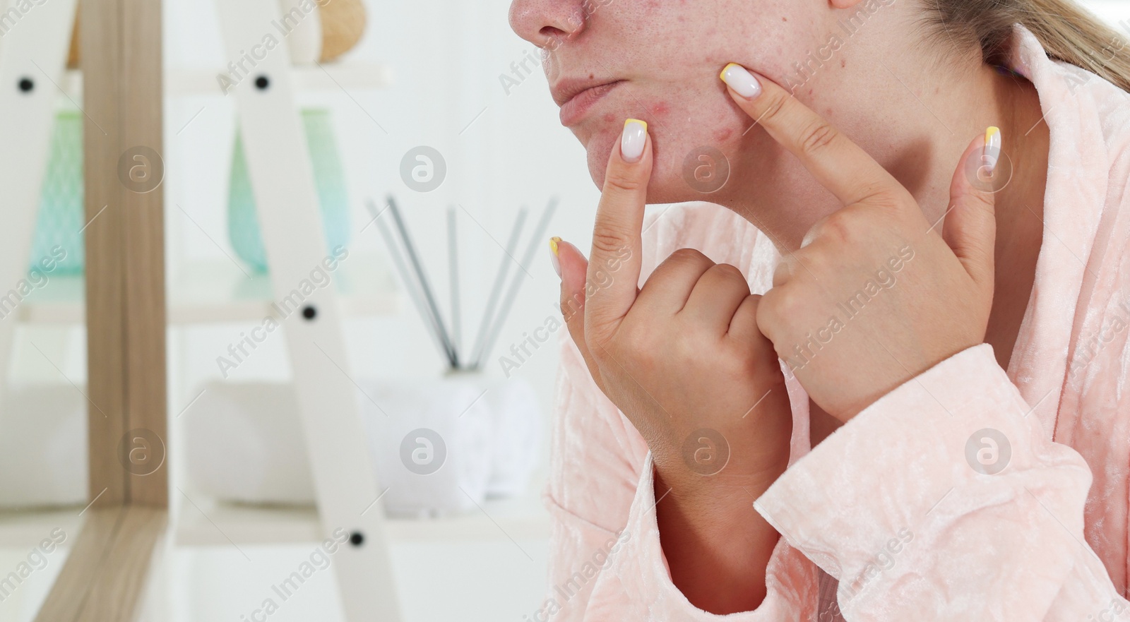 Woman popping pimple in bathroom, space for text. Acne problem Photo of Woman popping pimple in bathroom, space for text. Acne problem