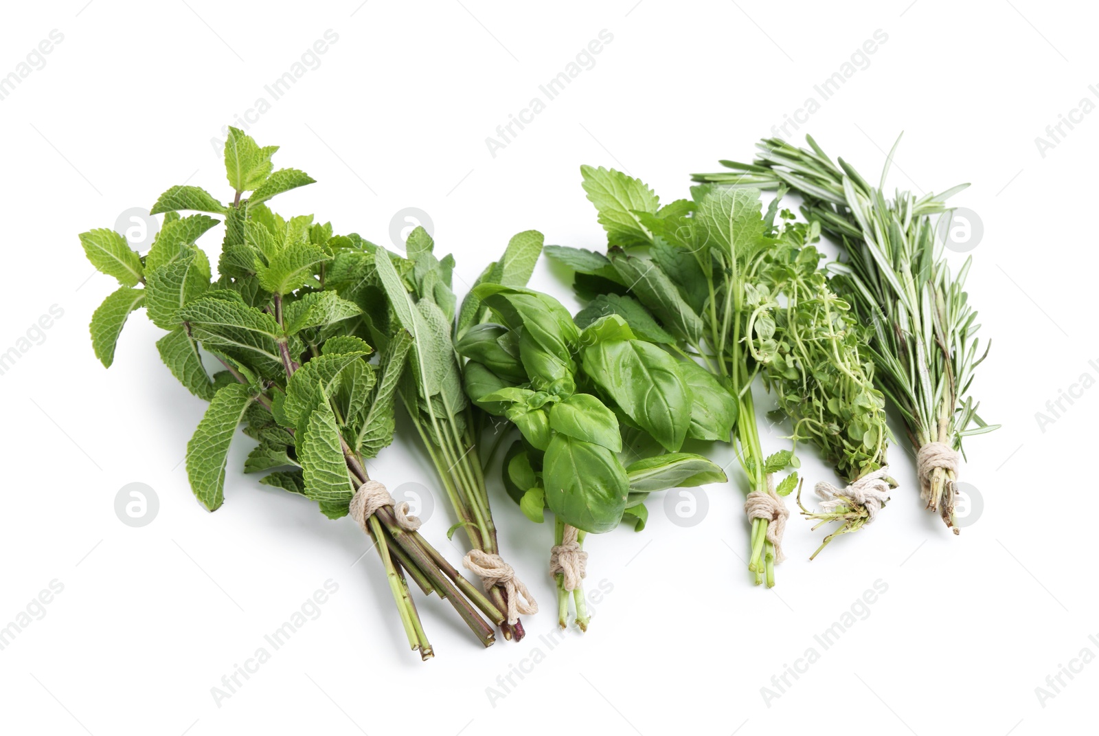 Different fresh green herbs isolated on white, above view Photo of Different fresh green herbs isolated on white, above view