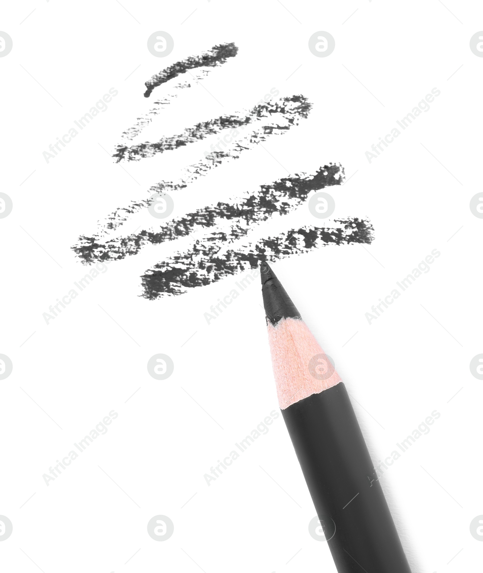 Black eyebrow pencil and strokes isolated on white, top view Photo of Black eyebrow pencil and strokes isolated on white, top view