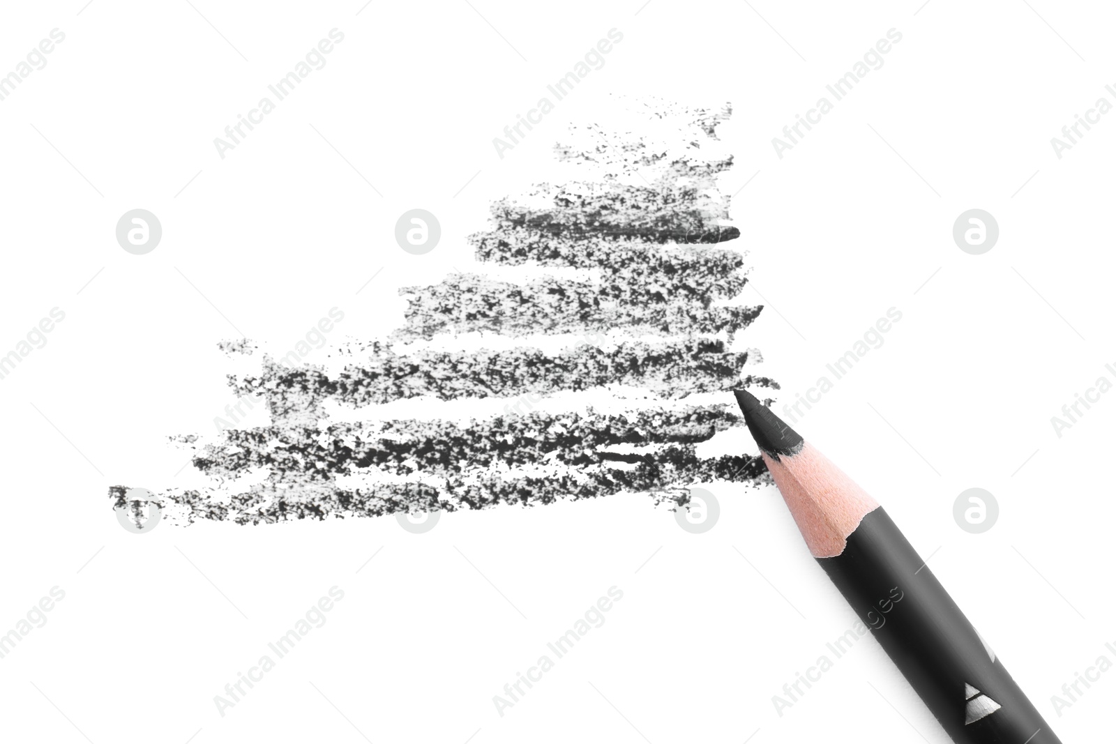 Black eyebrow pencil and strokes isolated on white, top view Photo of Black eyebrow pencil and strokes isolated on white, top view