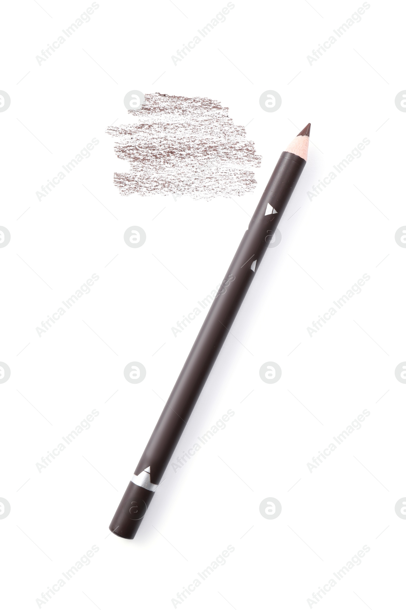 Brown eyebrow pencil and strokes isolated on white, top view Photo of Brown eyebrow pencil and strokes isolated on white, top view