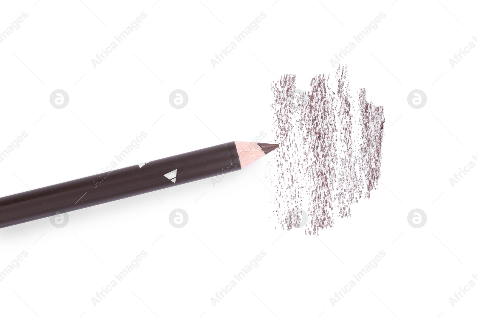 Brown eyebrow pencil and strokes isolated on white, top view Photo of Brown eyebrow pencil and strokes isolated on white, top view