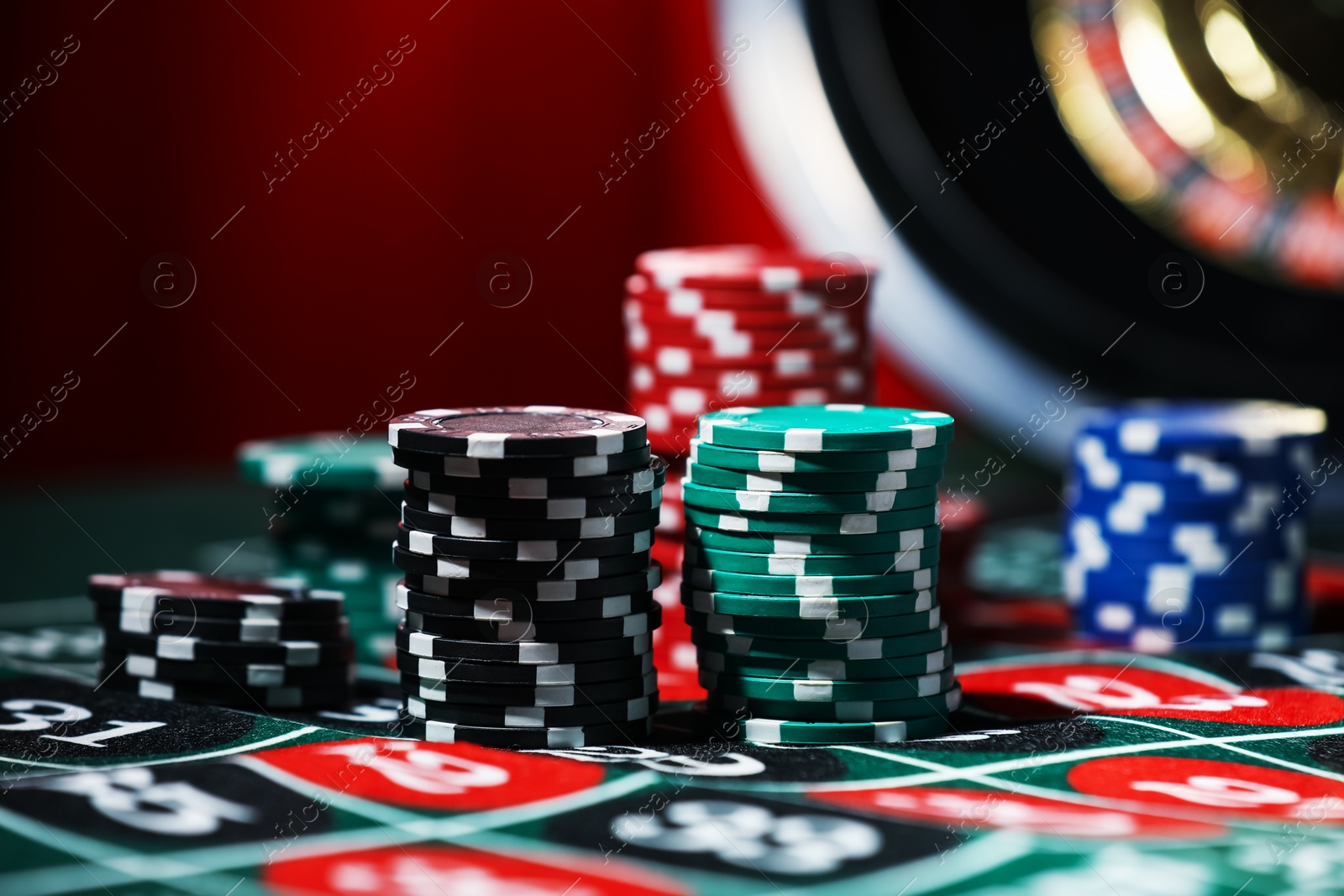 Casino chips on roulette table, closeup. Gambling addiction Photo of Casino chips on roulette table, closeup. Gambling addiction