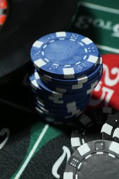 Photo of Casino chips on roulette table, closeup view