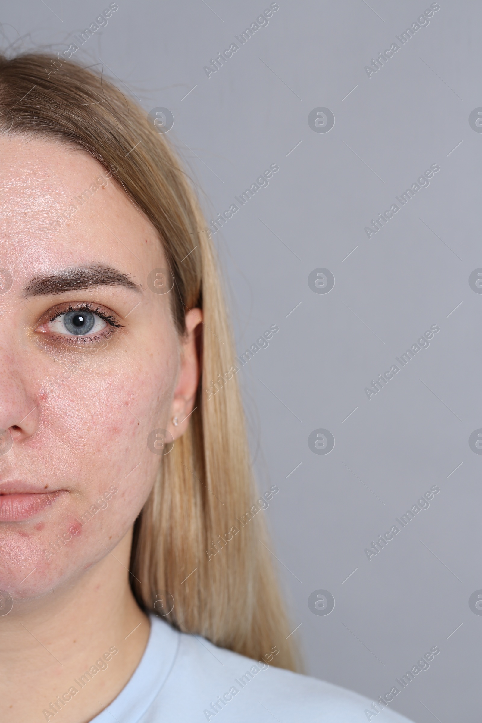 Closeup view of woman on grey background, space for text Photo of Closeup view of woman on grey background, space for text