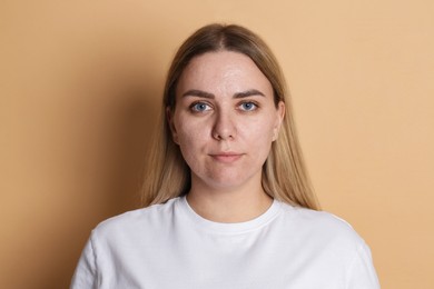 Photo of Portrait of beautiful woman on beige background