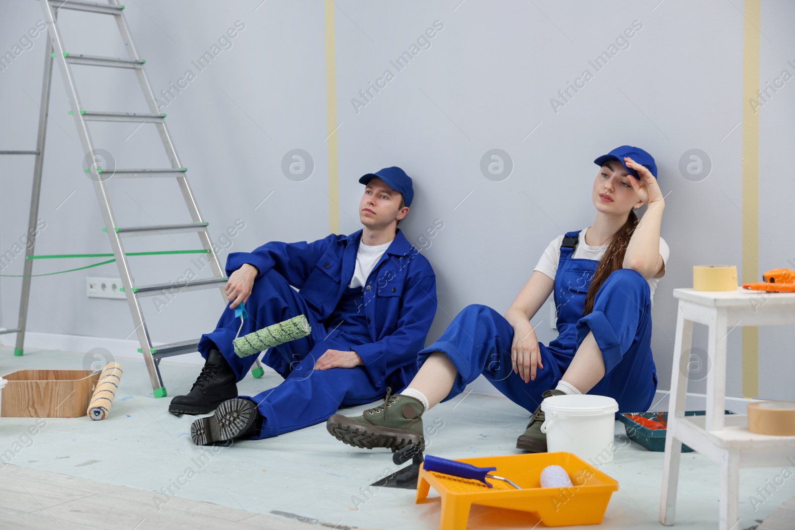 Workers having break during renovation in room Photo of Workers having break during renovation in room