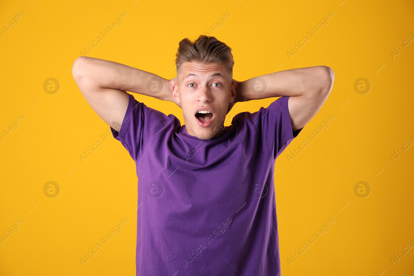 Portrait of surprised man on orange background Photo of Portrait of surprised man on orange background