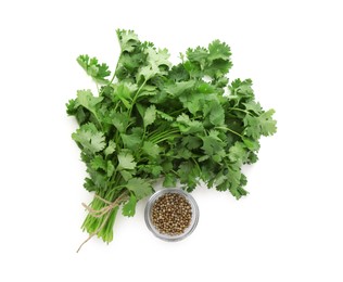 Photo of Fresh cilantro and coriander seeds isolated on white, top view