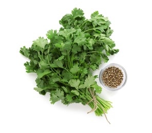Photo of Fresh cilantro and coriander seeds isolated on white, top view
