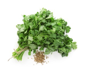 Photo of Fresh cilantro and coriander seeds isolated on white, top view