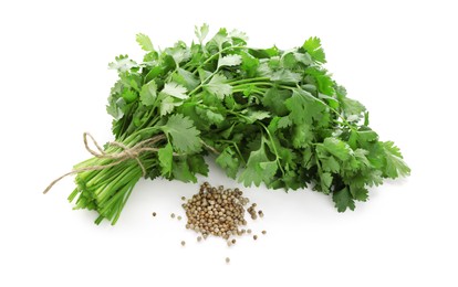 Photo of Fresh cilantro and coriander seeds isolated on white