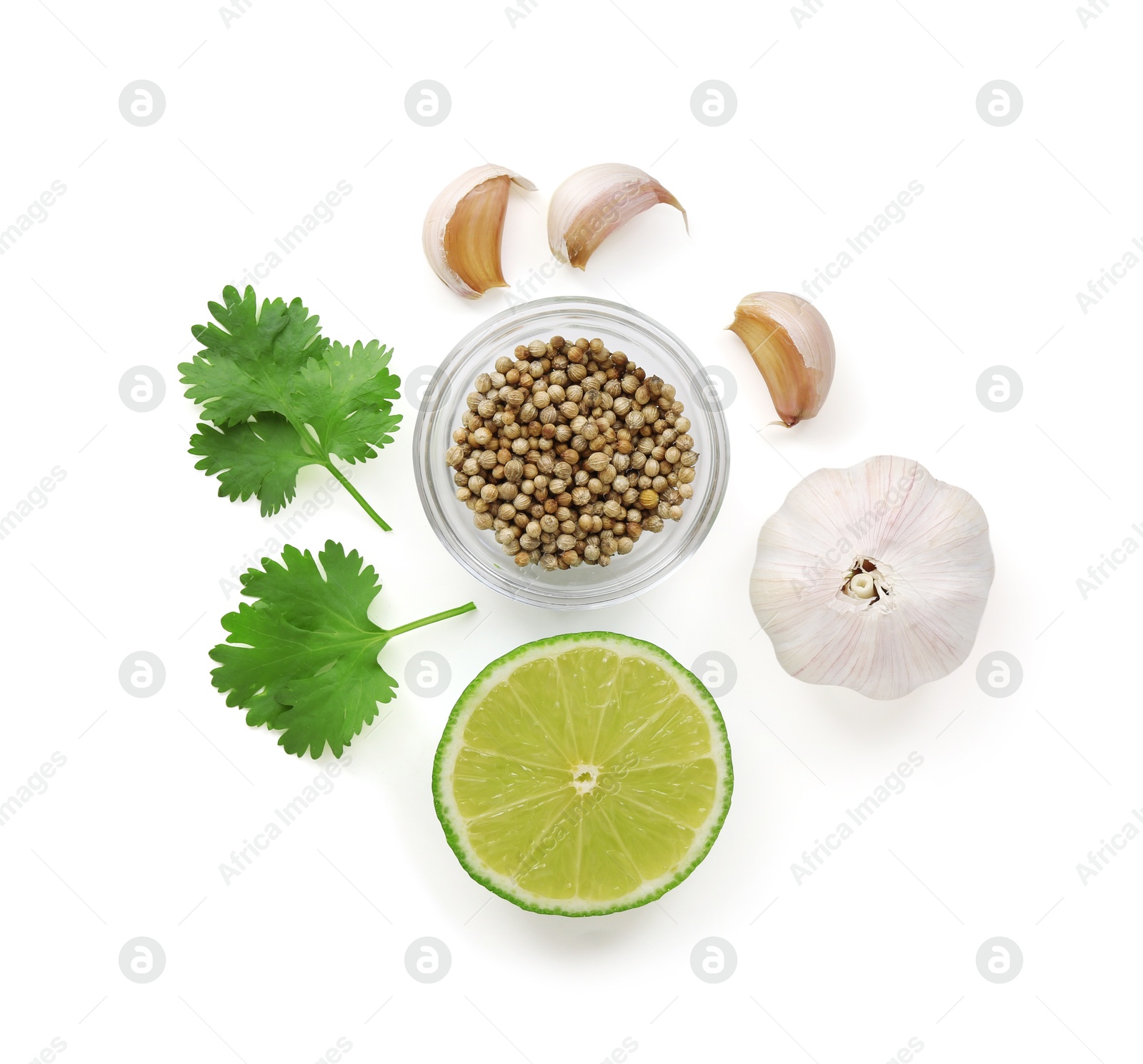Photo of Fresh cilantro, coriander seeds, lime and garlic isolated on white, top view