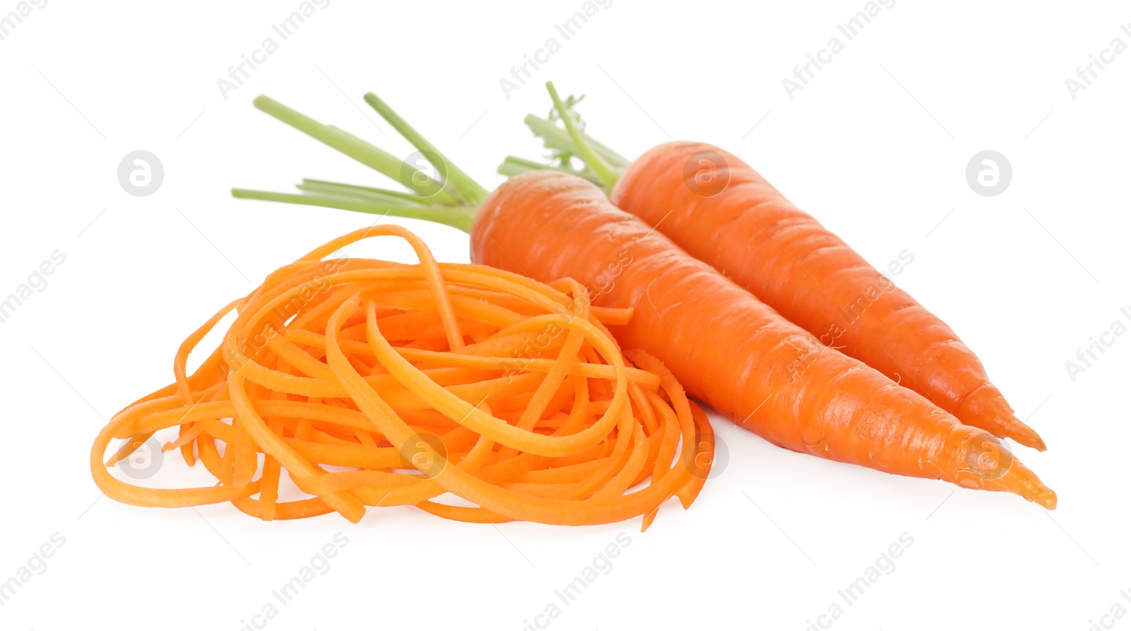 Raw carrot noodles and fresh vegetables isolated on white. Vegetarian dish Photo of Raw carrot noodles and fresh vegetables isolated on white. Vegetarian dish