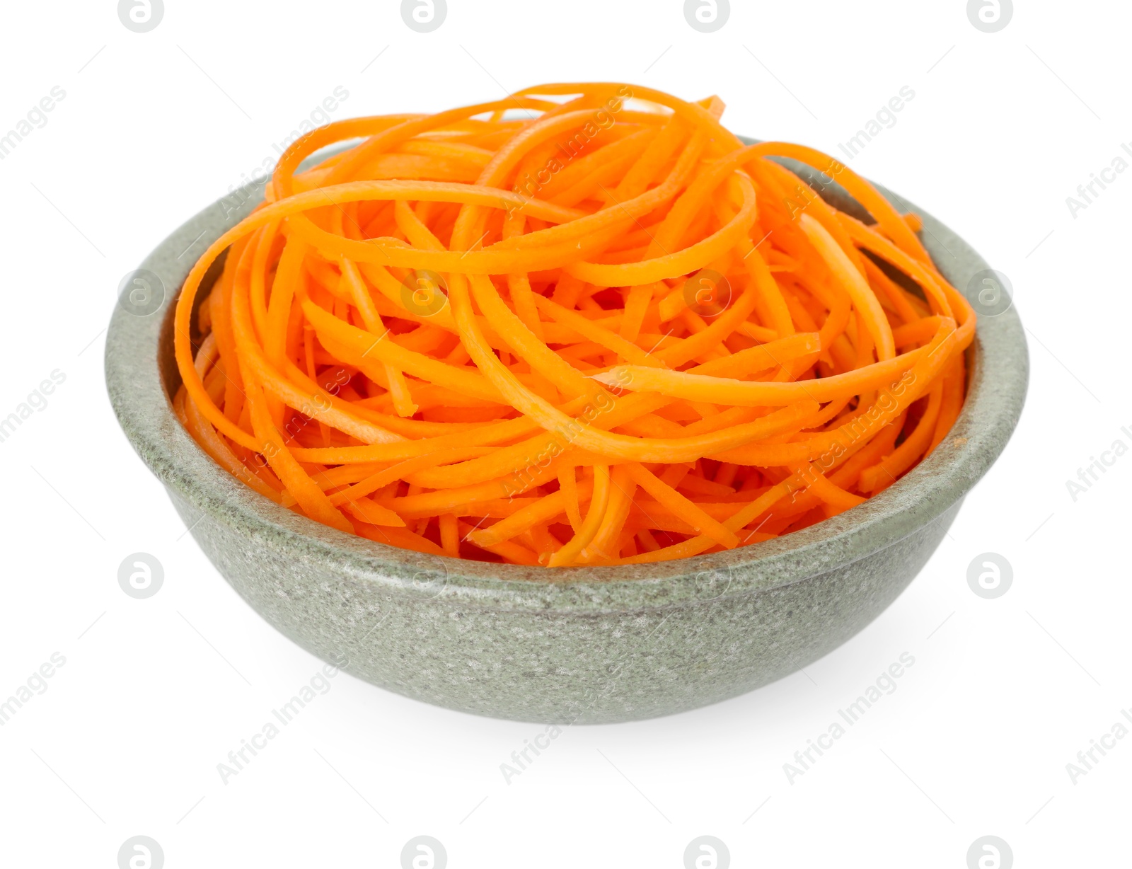 Raw carrot noodles in bowl isolated on white. Vegetarian dish Photo of Raw carrot noodles in bowl isolated on white. Vegetarian dish
