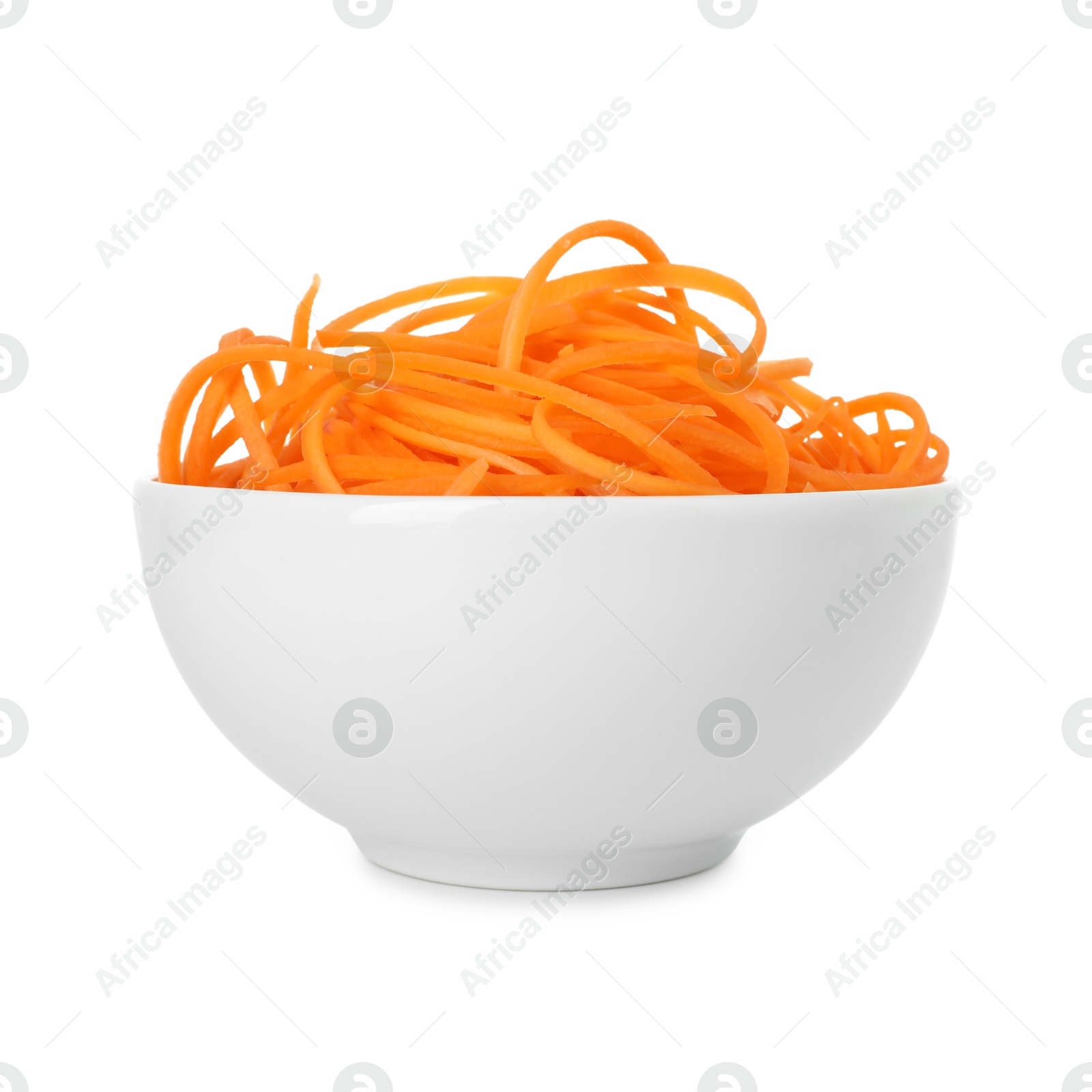Raw carrot noodles in bowl isolated on white. Vegetarian dish Photo of Raw carrot noodles in bowl isolated on white. Vegetarian dish