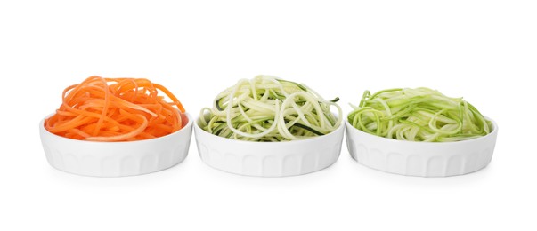 Photo of Different vegetable noodles in bowls isolated on white. Vegetarian dish