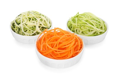 Photo of Different vegetable noodles in bowls isolated on white. Vegetarian dish