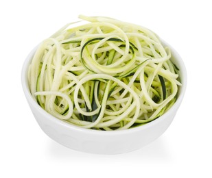 Photo of Raw zucchini noodles in bowl isolated on white. Vegetarian dish