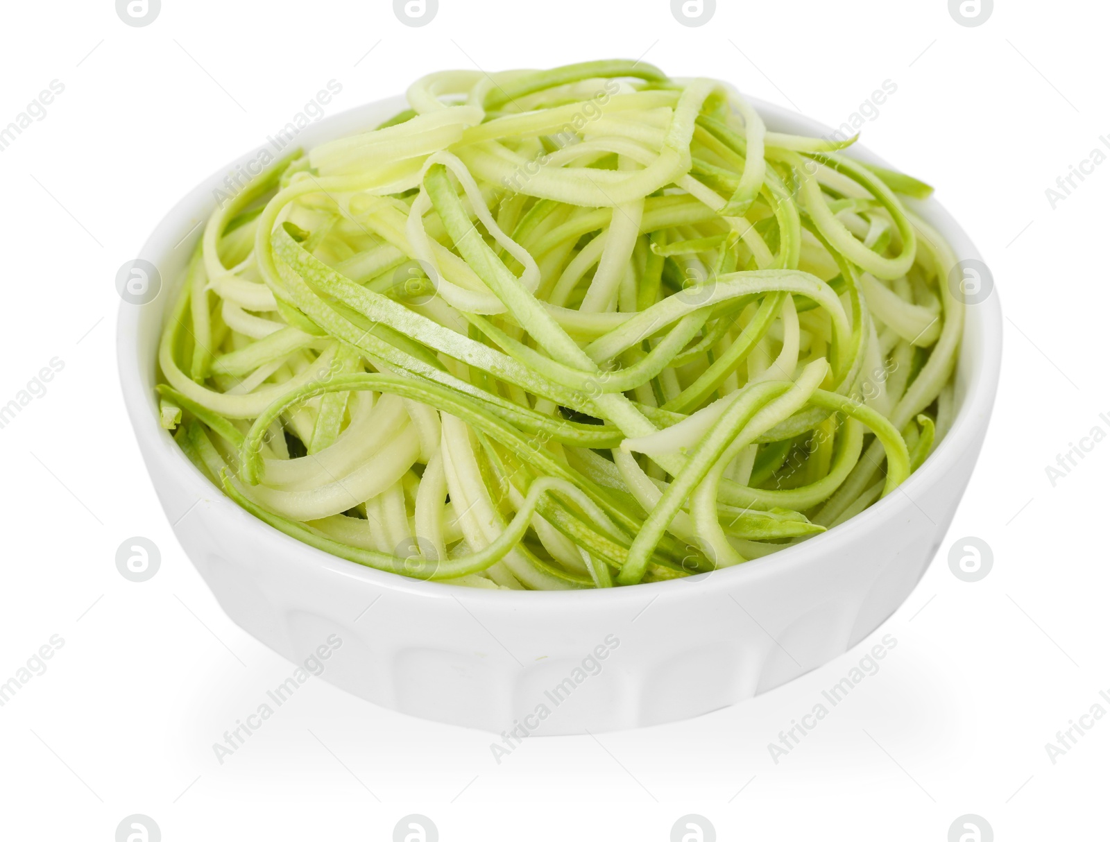 Raw squash noodles in bowl isolated on white. Vegetarian dish Photo of Raw squash noodles in bowl isolated on white. Vegetarian dish
