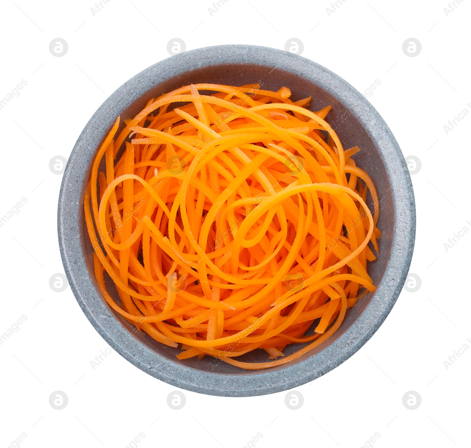 Raw carrot noodles in bowl isolated on white, top view. Vegetarian dish Photo of Raw carrot noodles in bowl isolated on white, top view. Vegetarian dish