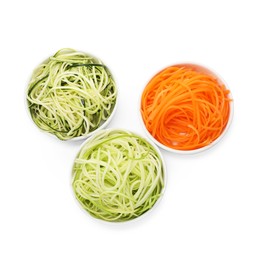 Photo of Different vegetable noodles in bowls isolated on white, top view. Vegetarian dish
