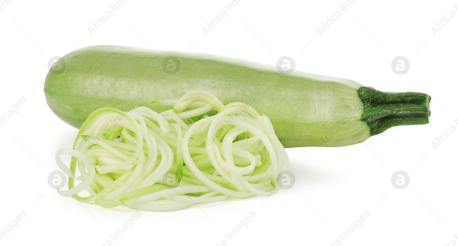 Photo of Raw squash noodles and fresh vegetable isolated on white. Vegetarian dish