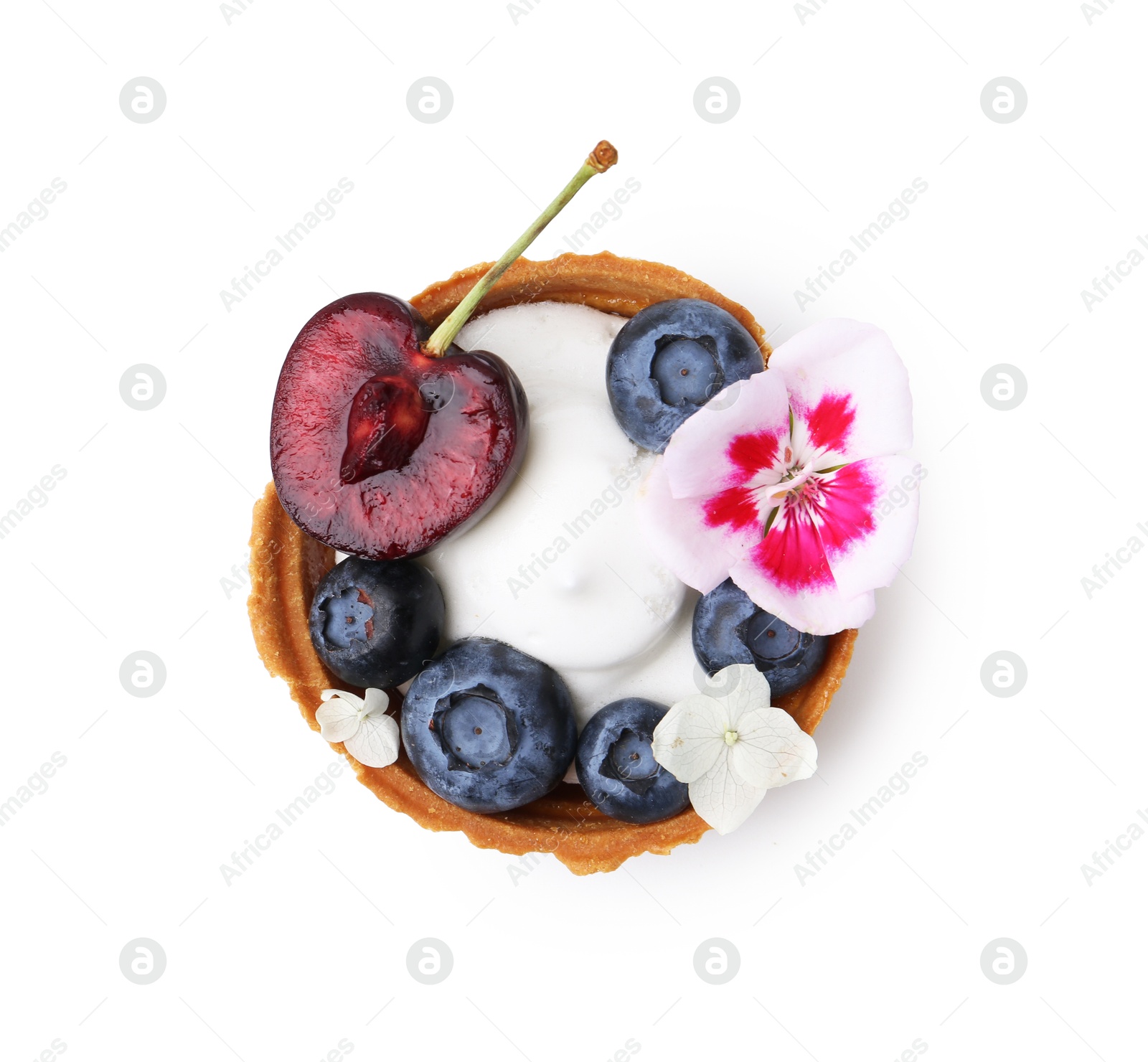 One sweet tartlet with berries and flowers isolated on white, top view. Delicious dessert Photo of One sweet tartlet with berries and flowers isolated on white, top view. Delicious dessert