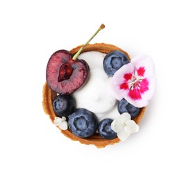 Photo of One sweet tartlet with berries and flowers isolated on white, top view. Delicious dessert
