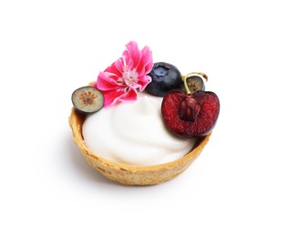 Photo of One sweet tartlet with berries and flower isolated on white. Delicious dessert
