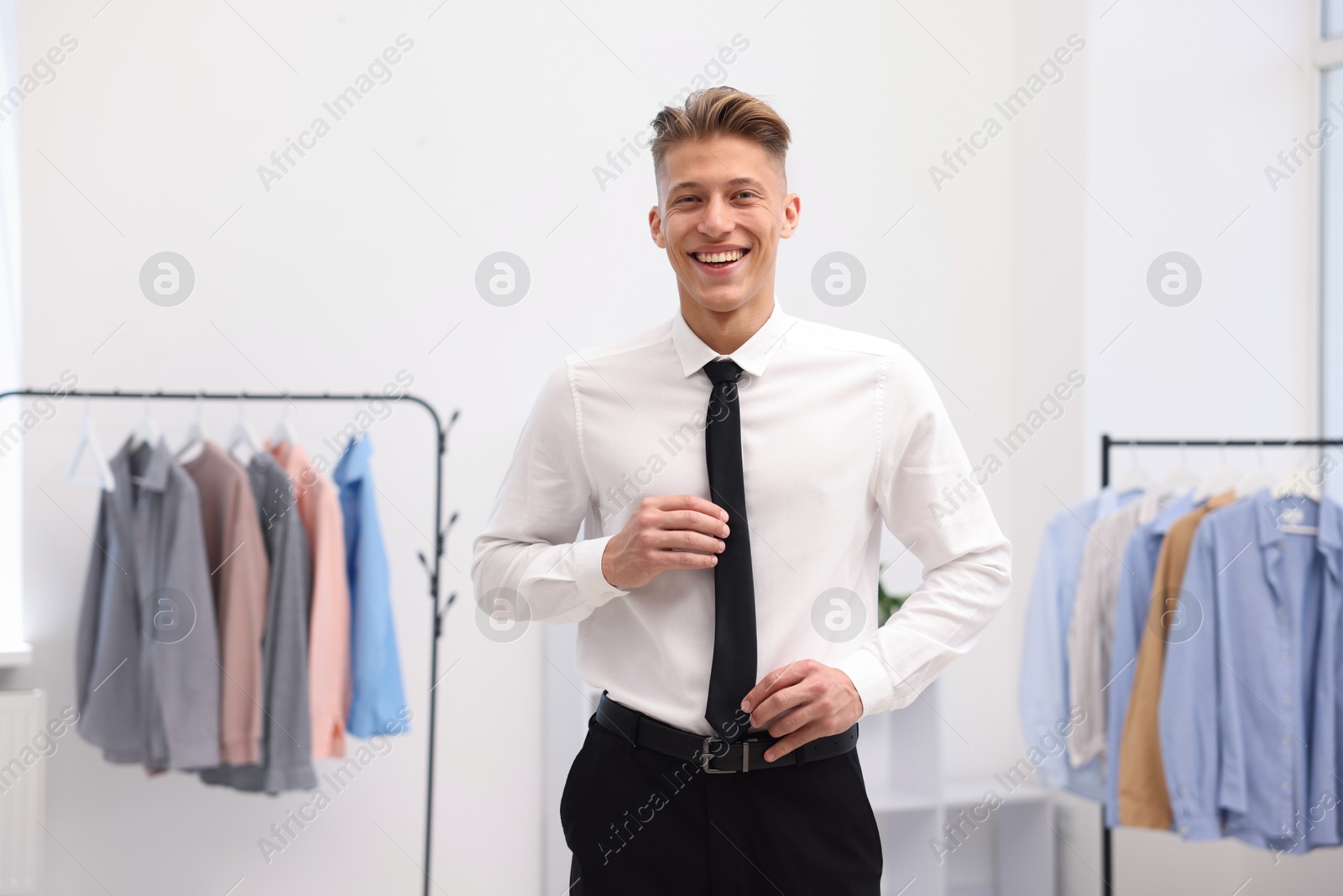 Photo of Happy man in formal attire at atelier